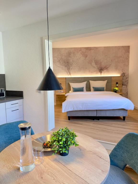 Postel nebo postele na pokoji v ubytování Living & Serviced Apartments by Blauer Wolf