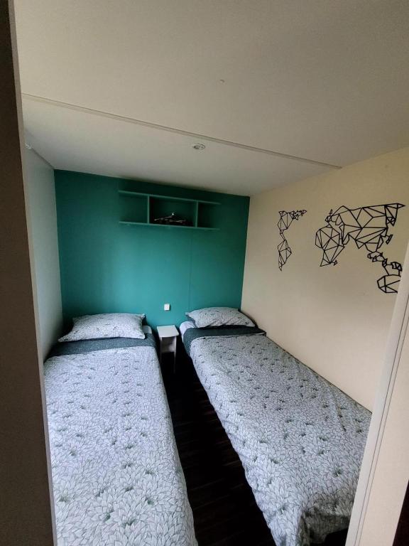 Postel nebo postele na pokoji v ubytování Mobil home Capbreton