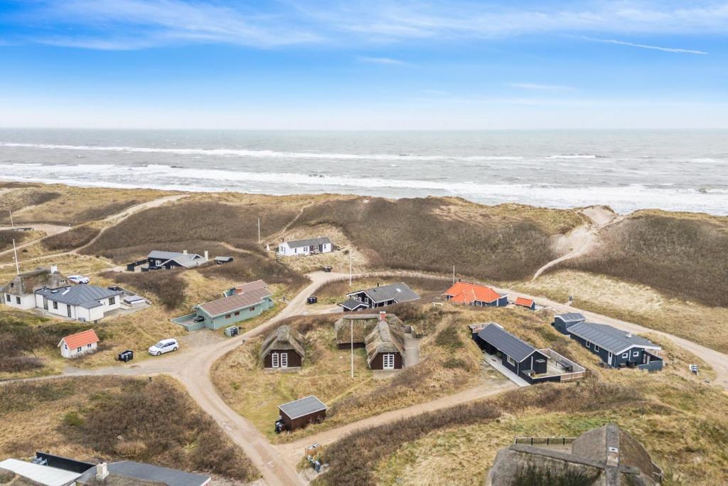 an aerial view of a house on the beach at Feriehus 1107 in Ringkøbing