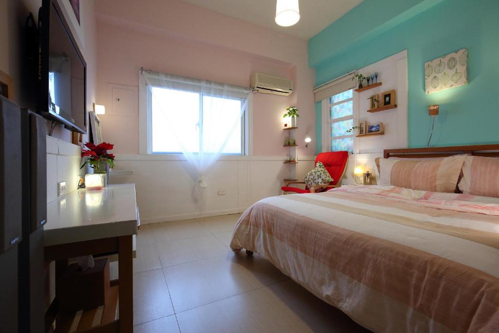 Postel nebo postele na pokoji v ubytování Huxi B&B