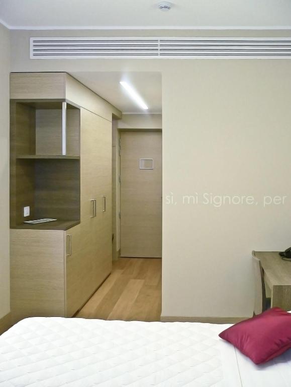 Łóżko lub łóżka w pokoju w obiekcie Hotel Il Cantico St. Peter