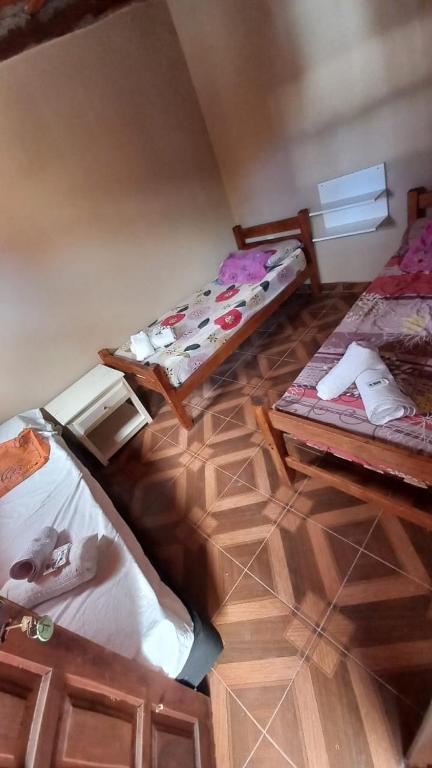 Postel nebo postele na pokoji v ubytování Hostal del Cerro