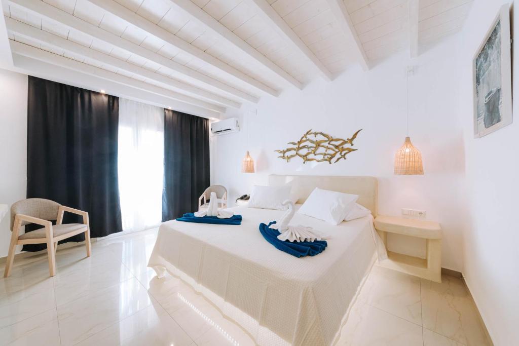 Postel nebo postele na pokoji v ubytování HOTIDAY Room Collection - Naxos