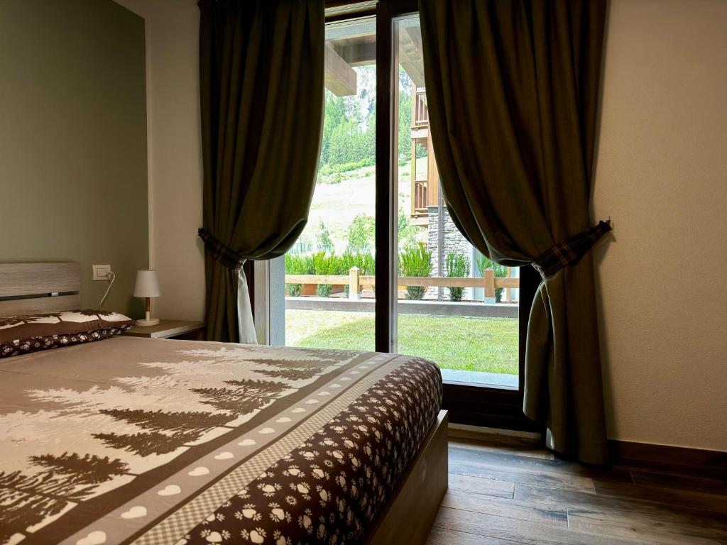 Postel nebo postele na pokoji v ubytování Isolaccia angolo di paradiso