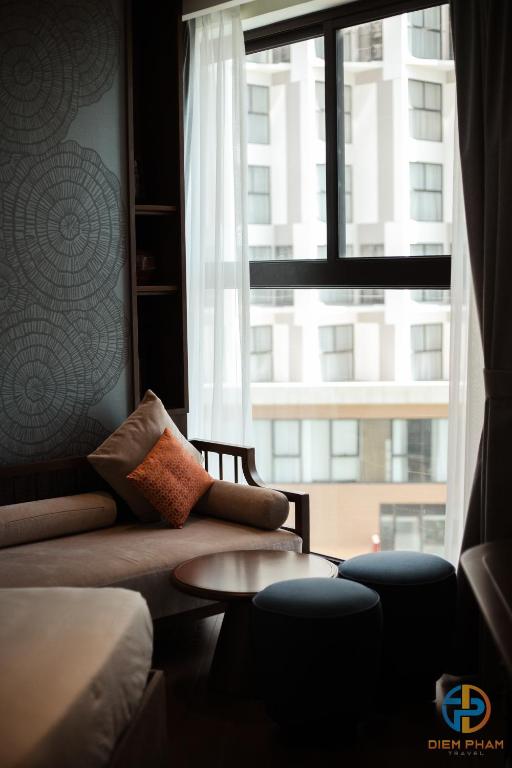 Giường trong phòng chung tại Apec Mandala Cham Bay Mui Ne - Ruby Apartment