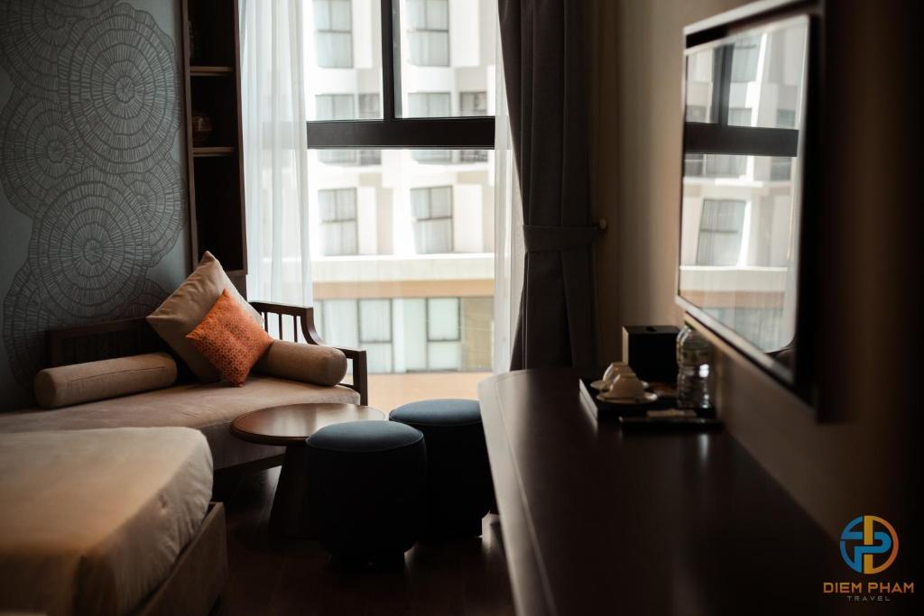 Giường trong phòng chung tại Apec Mandala Cham Bay Mui Ne - Ruby Apartment