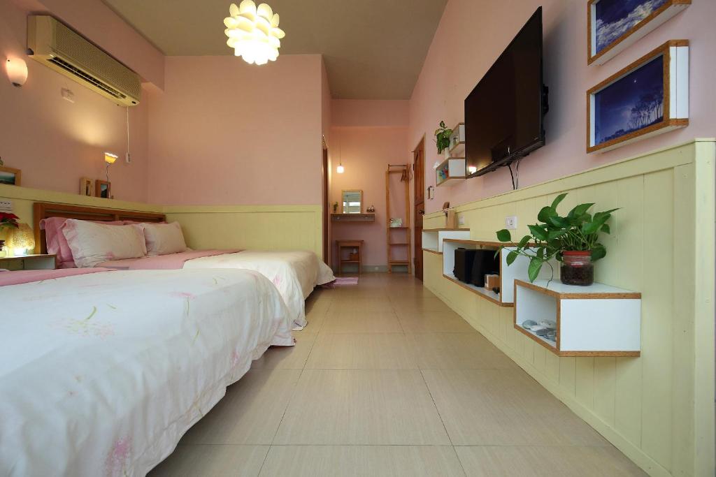 TV a/nebo společenská místnost v ubytování Huxi B&B
