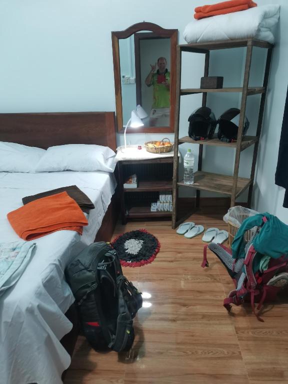 Postel nebo postele na pokoji v ubytování Bar Ang Guesthouse