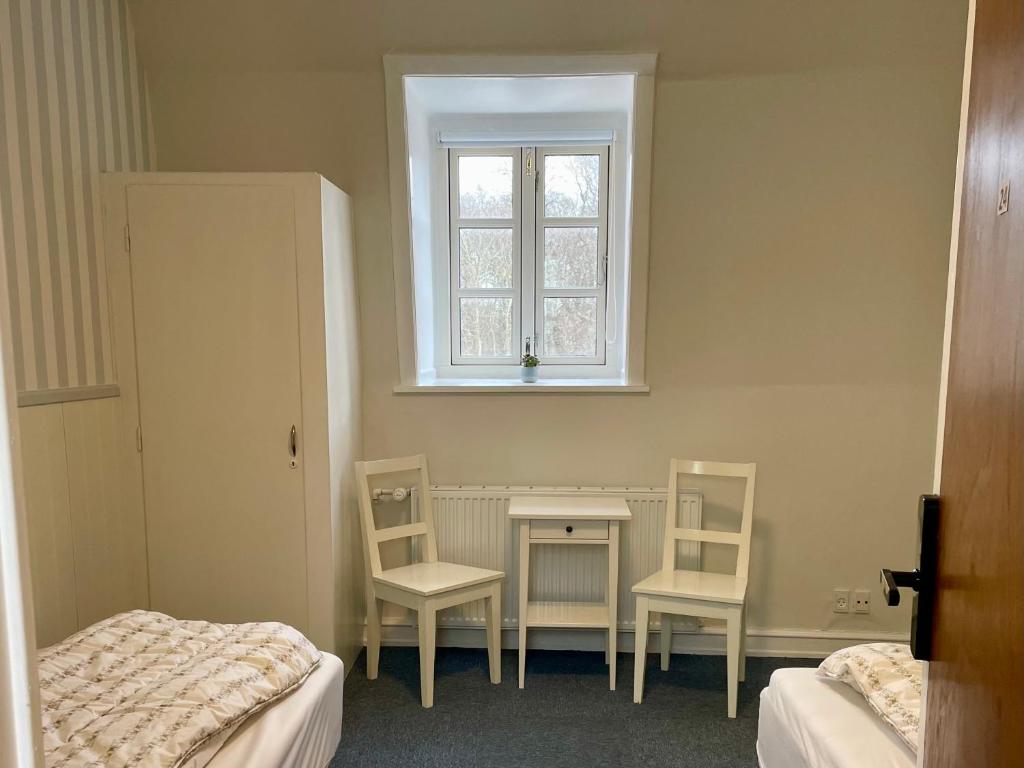Postel nebo postele na pokoji v ubytování Korinth Kro Hostel