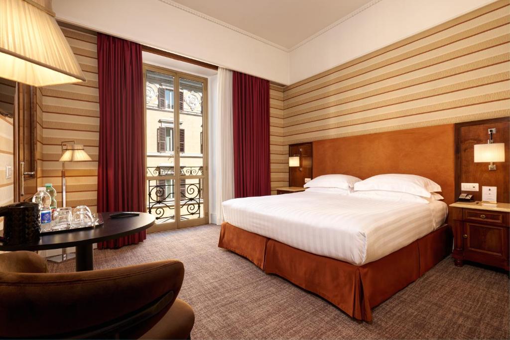 Postel nebo postele na pokoji v ubytování Hotel Mascagni
