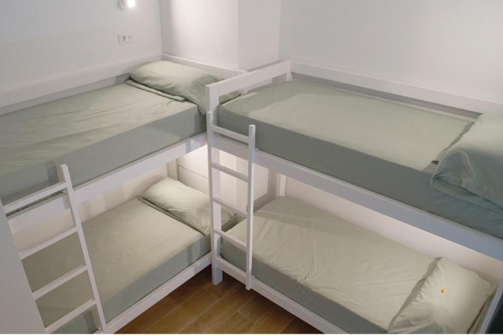 Postel nebo postele na pokoji v ubytování Aiora Hostel