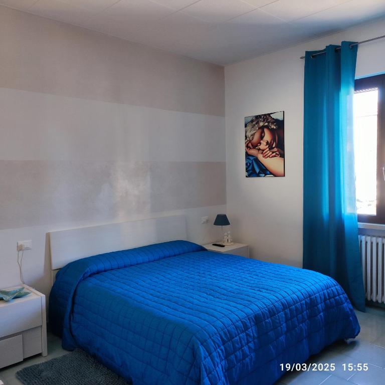 Postel nebo postele na pokoji v ubytování Casapatrizia B&B Sirmione