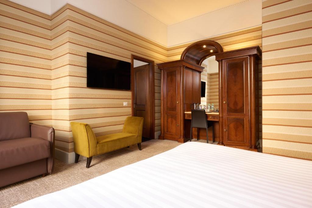 Postel nebo postele na pokoji v ubytování Hotel Mascagni