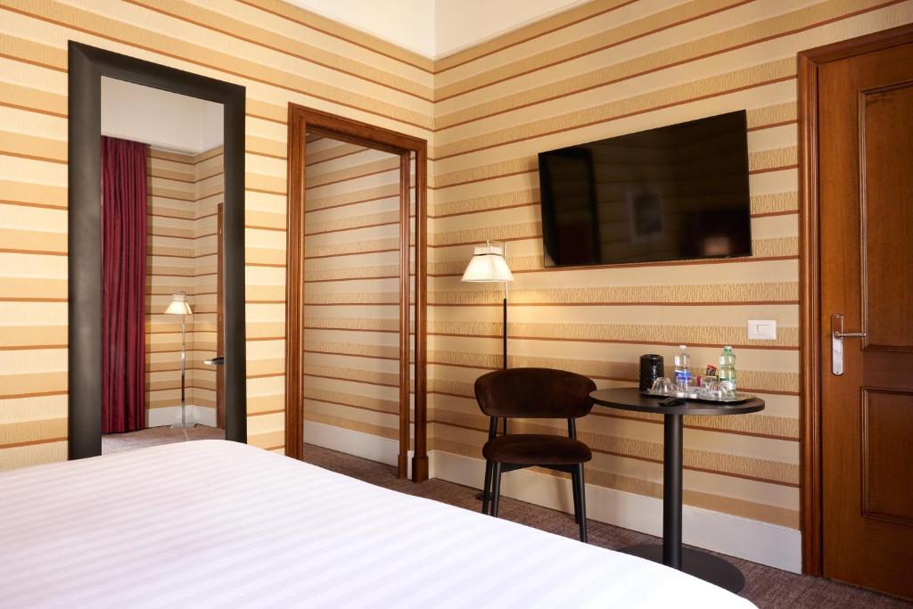 Postel nebo postele na pokoji v ubytování Hotel Mascagni