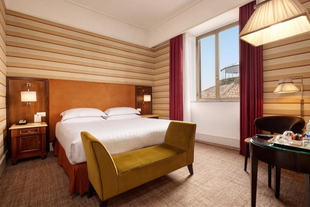 Postel nebo postele na pokoji v ubytování Hotel Mascagni