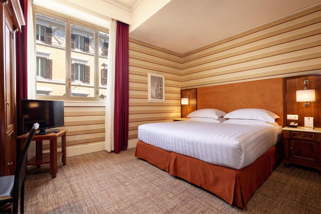 Postel nebo postele na pokoji v ubytování Hotel Mascagni