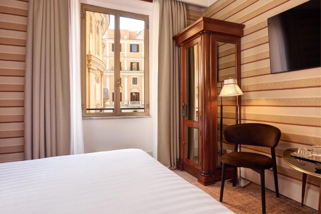 Postel nebo postele na pokoji v ubytování Hotel Mascagni