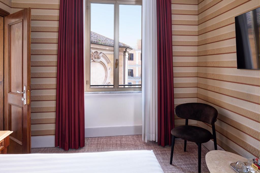 Postel nebo postele na pokoji v ubytování Hotel Mascagni