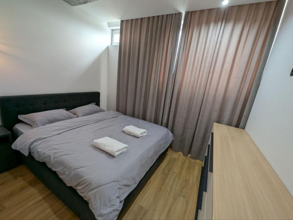 Una cama o camas en una habitación de Unic Stefan Cel Mare
