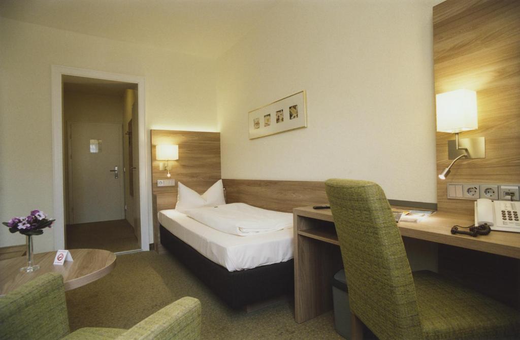 Postel nebo postele na pokoji v ubytování Hotel Jedermann