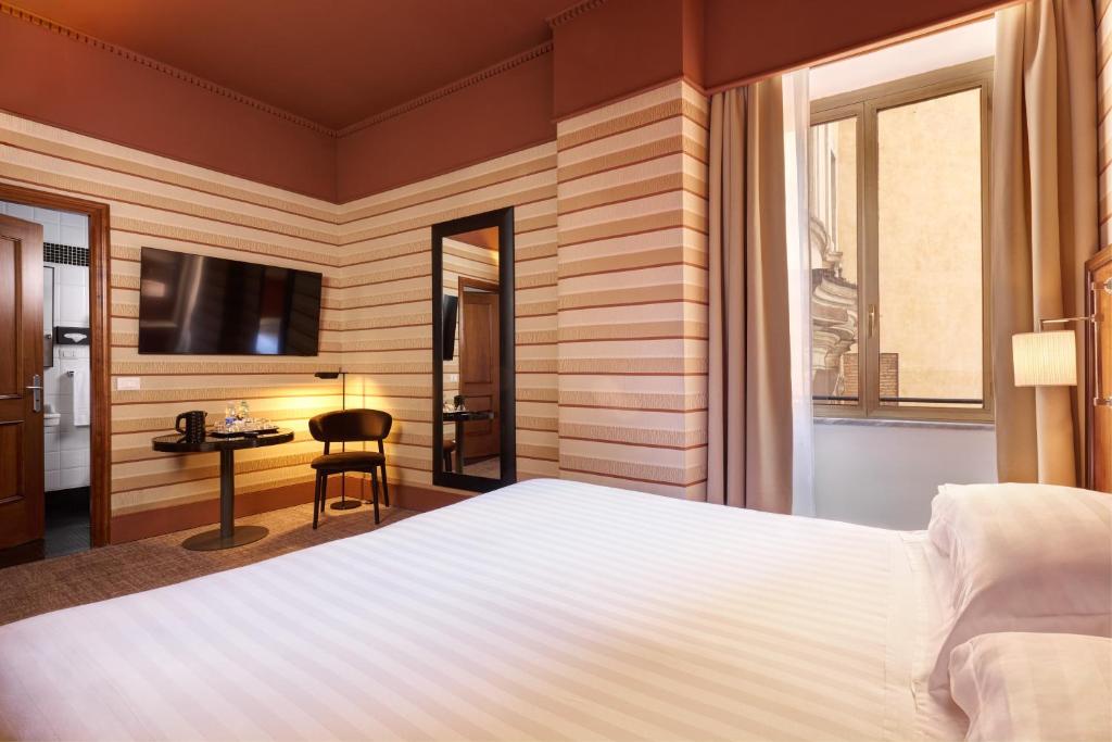 Postel nebo postele na pokoji v ubytování Hotel Mascagni