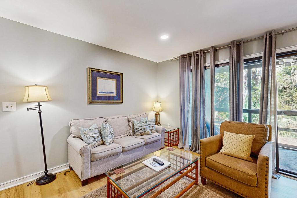 a living room with a couch and a chair at Mariner's Watch 4266 in Kiawah Island