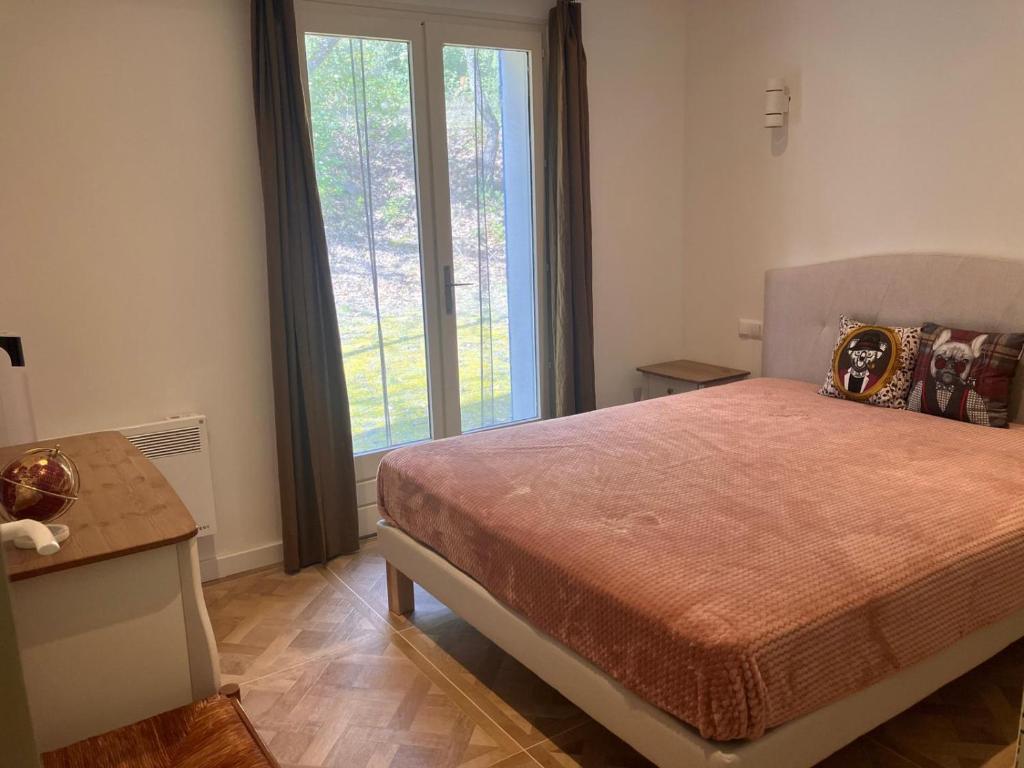 Postel nebo postele na pokoji v ubytování Villa Paradis des Oréades