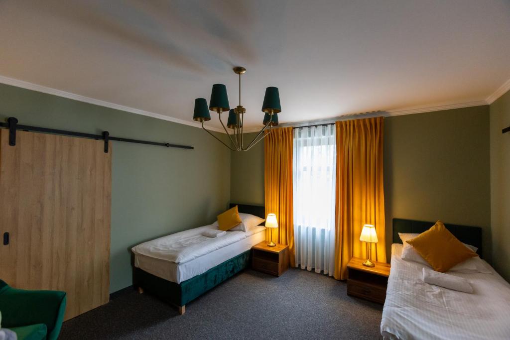 Postel nebo postele na pokoji v ubytování Noclegi na Wspólnej