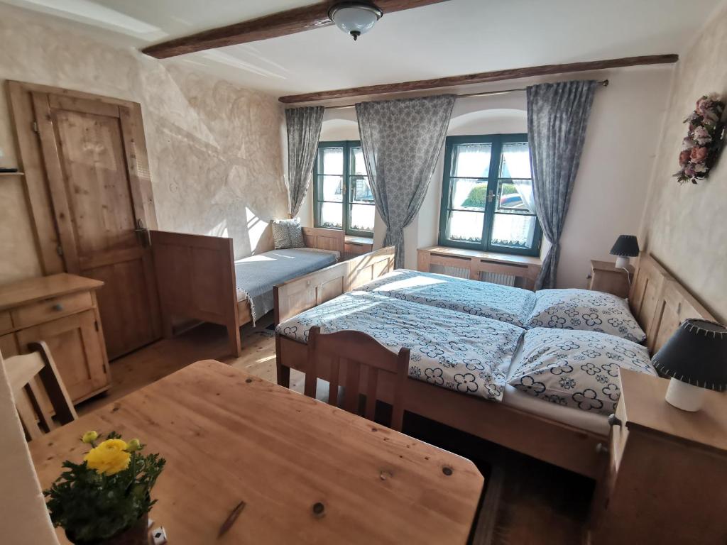 Postel nebo postele na pokoji v ubytování Apartmány U Koudelníka