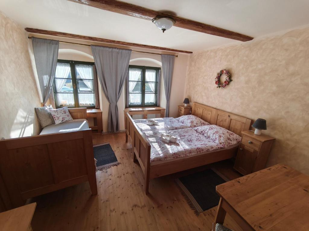 Postel nebo postele na pokoji v ubytování Apartmány U Koudelníka