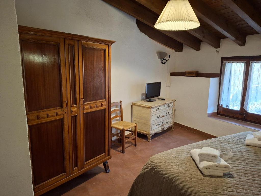 Postel nebo postele na pokoji v ubytování Cal Tonico Rural