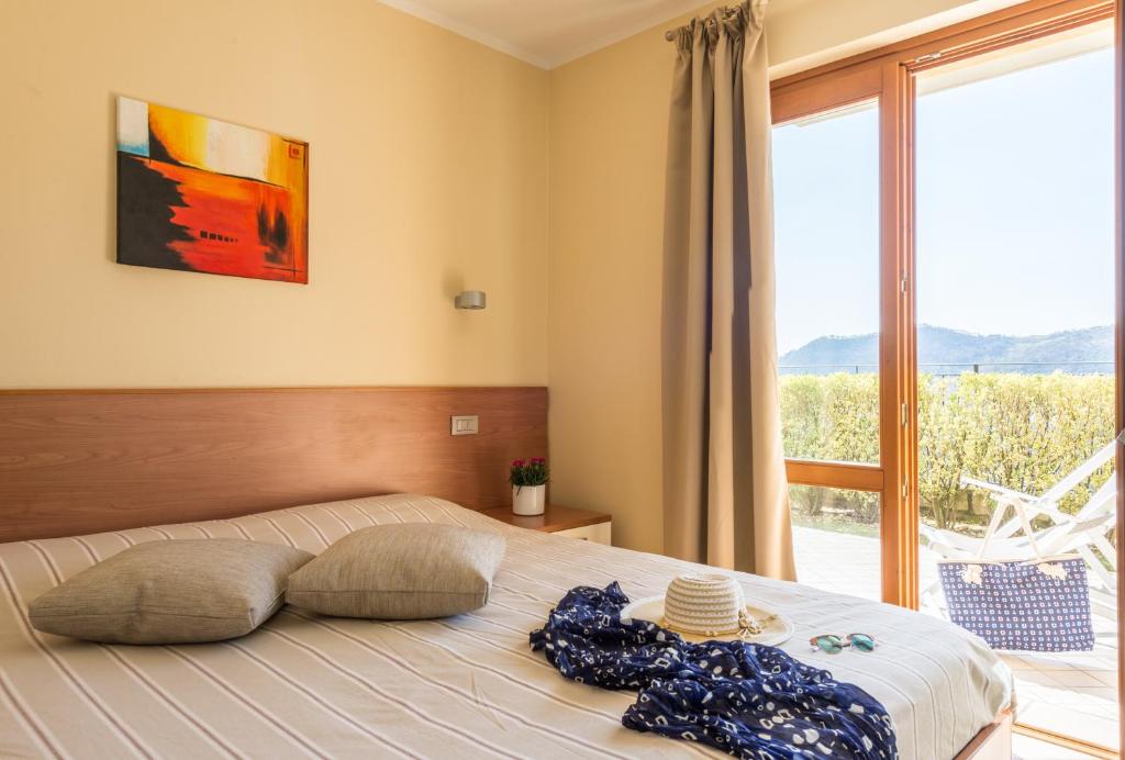 Postel nebo postele na pokoji v ubytování Residence La Berna