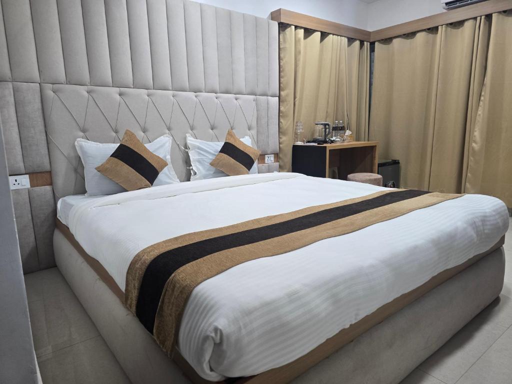 Voodi või voodid majutusasutuse Hotel Dayglow toas