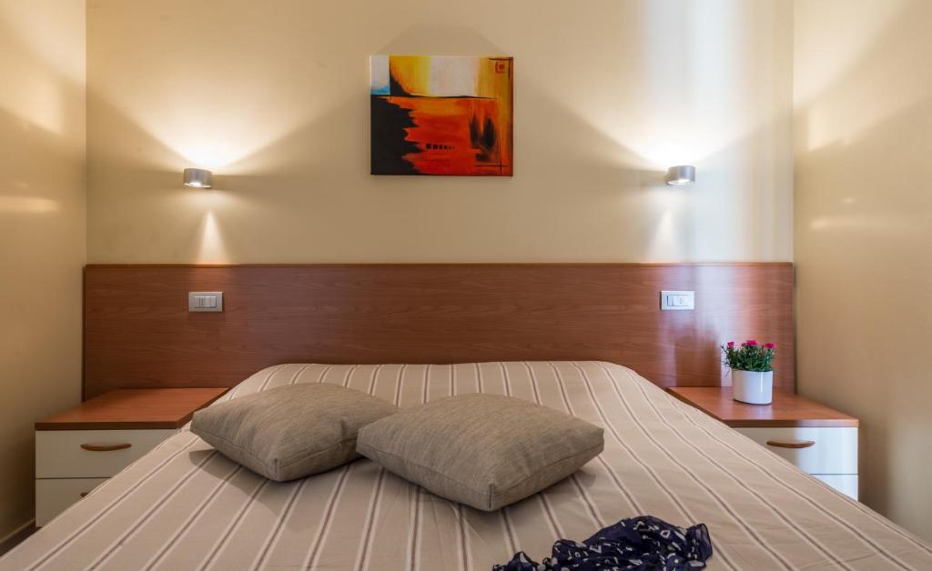 Postel nebo postele na pokoji v ubytování Residence La Berna