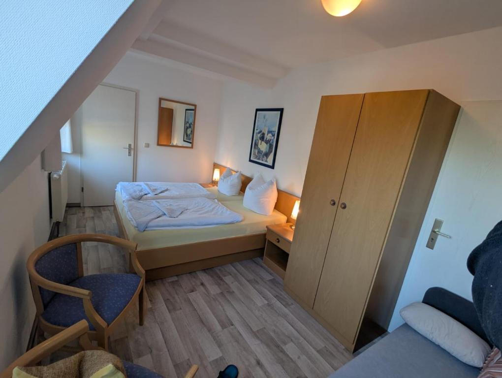 Postel nebo postele na pokoji v ubytování Pension & Restaurant Haus Hiddensee
