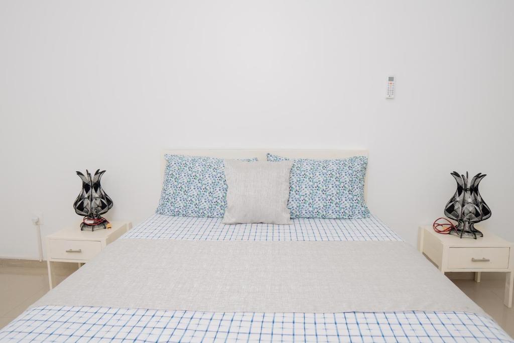 Postel nebo postele na pokoji v ubytování J Martins ApartHotel