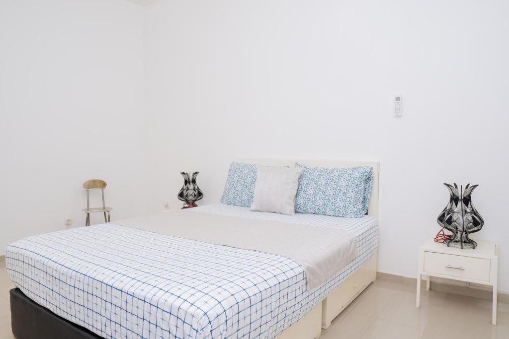 Postel nebo postele na pokoji v ubytování J Martins ApartHotel