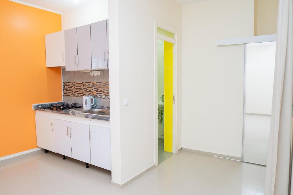 Kuchyň nebo kuchyňský kout v ubytování J Martins ApartHotel