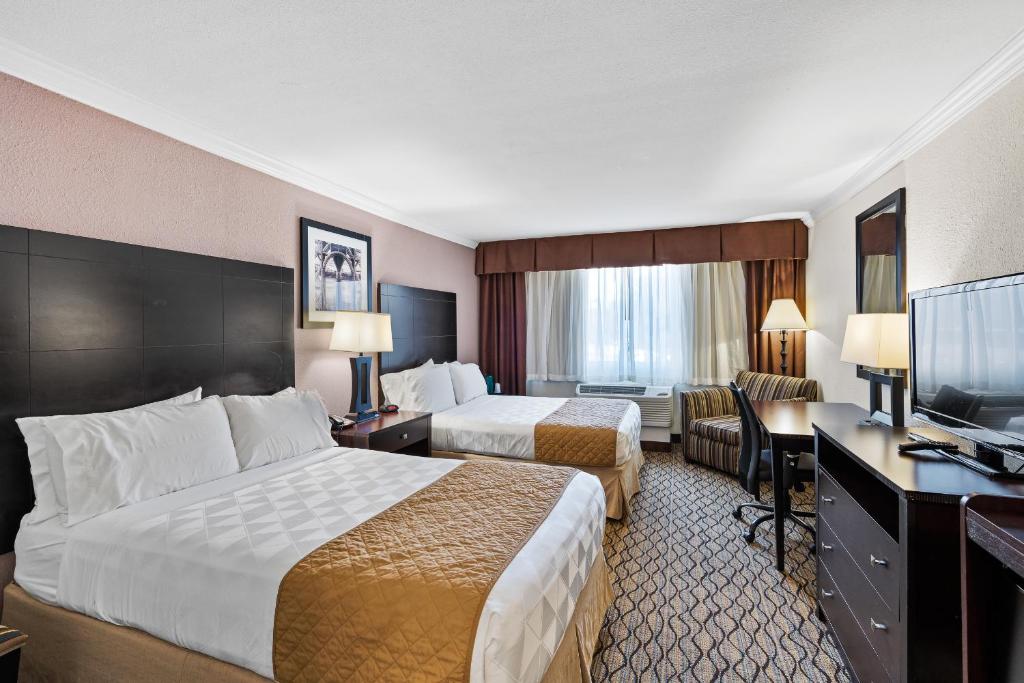 Postel nebo postele na pokoji v ubytování Executive Inn - Fort Lee