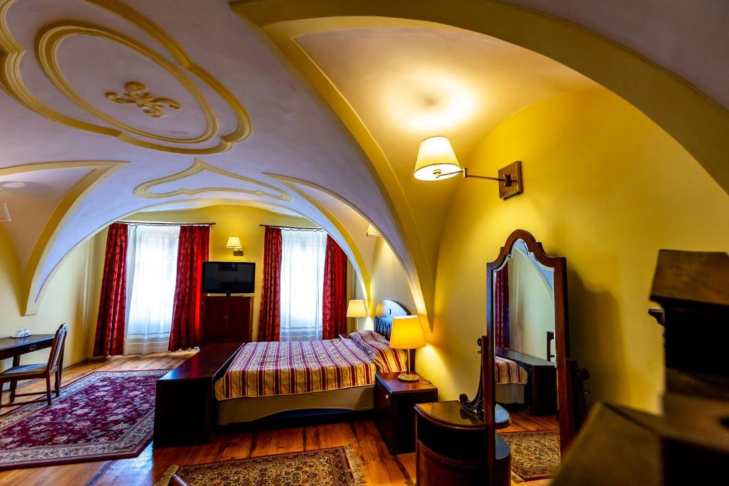 Postel nebo postele na pokoji v ubytování Hotel Casa Wagner