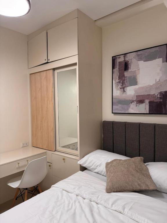 Postel nebo postele na pokoji v ubytování Casa de Vera Iloilo SMDC Style Residences