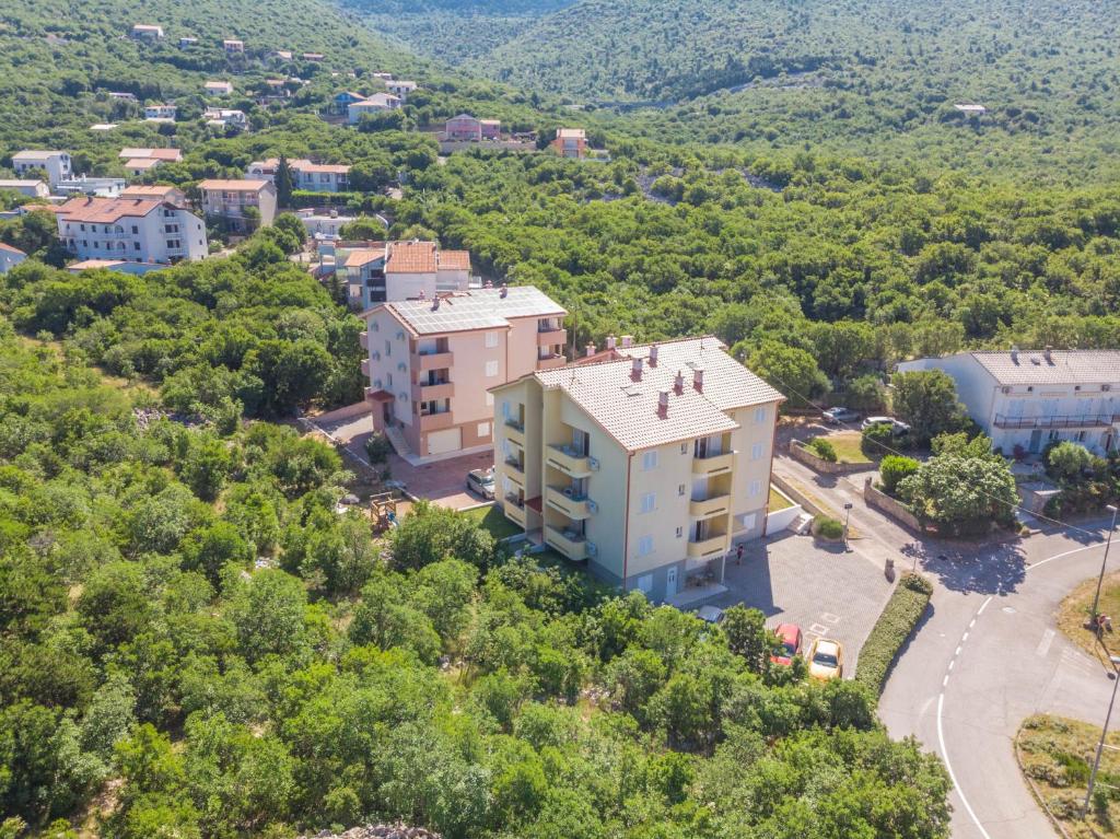 an aerial view of a building on a hill at Polina Apartmani in Klenovica