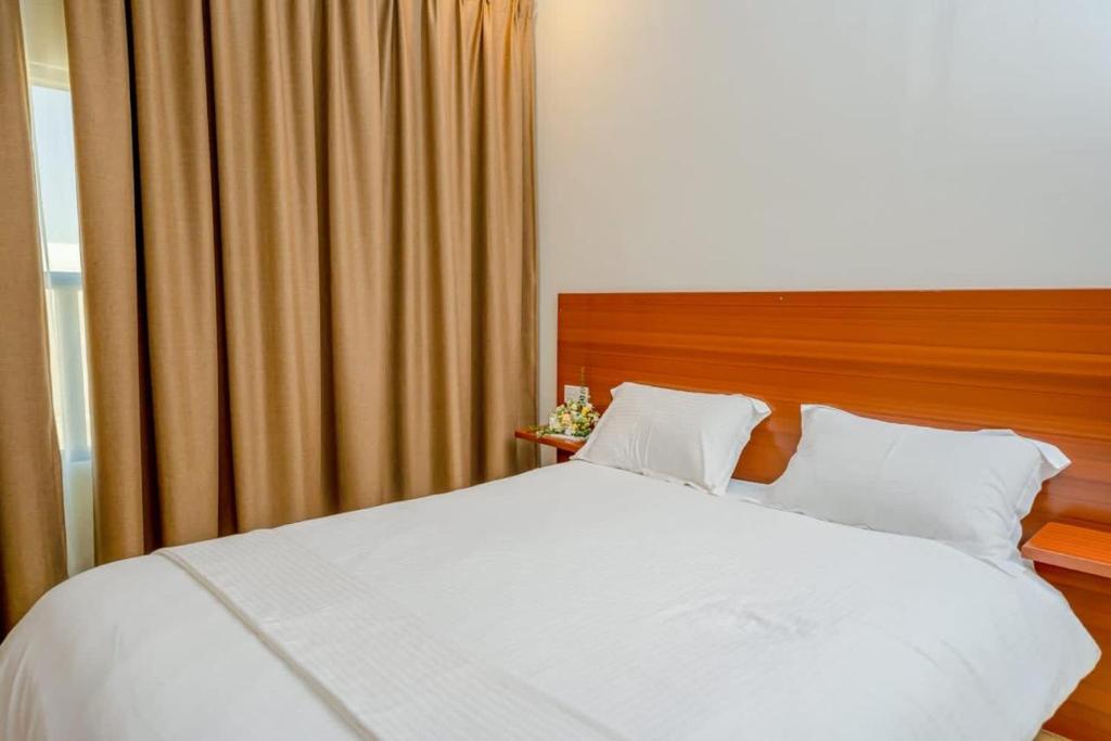 Postel nebo postele na pokoji v ubytování Bait AL-Afiah Apartments