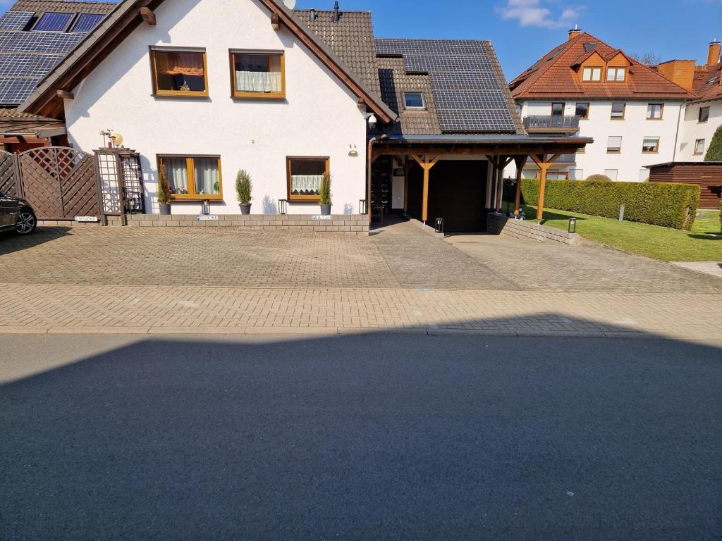 a house with a driveway in front of it at Casa Ulla am Hallenbad in Haiger