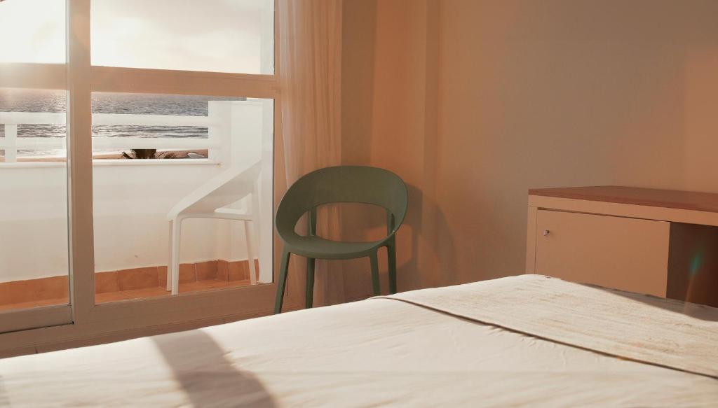 Postel nebo postele na pokoji v ubytování Hotel Vértice Chipiona Mar