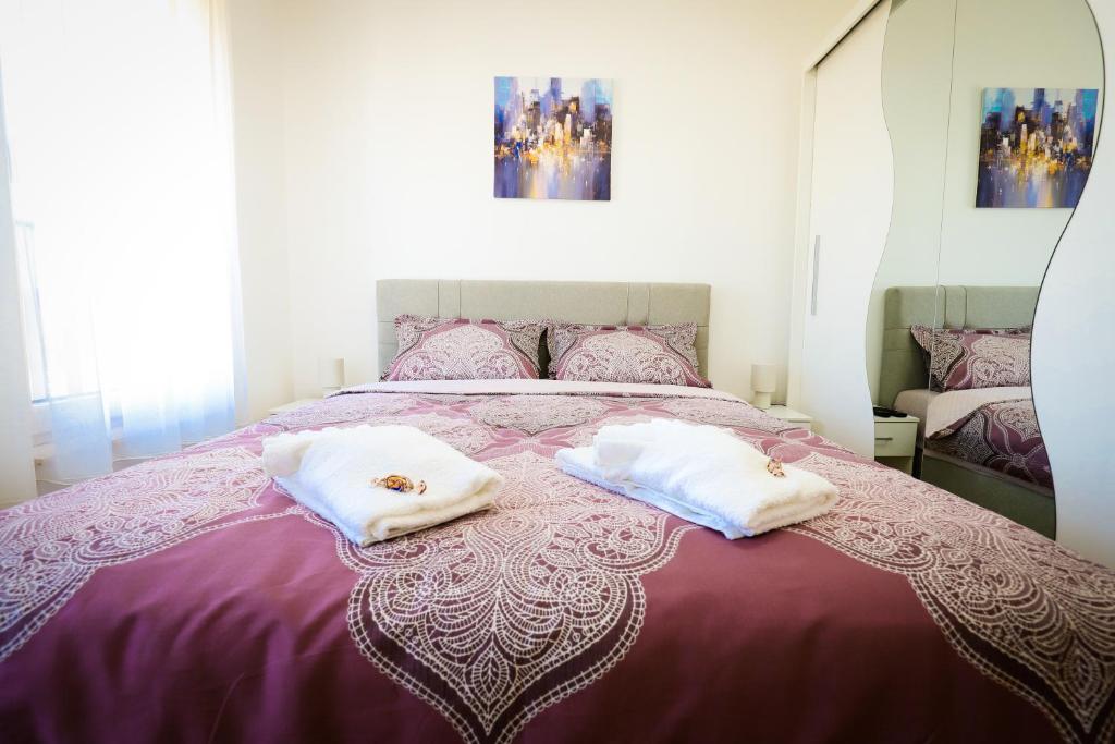 Postel nebo postele na pokoji v ubytování Apartman NN