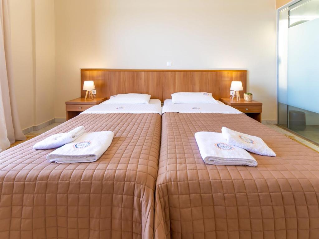 Postel nebo postele na pokoji v ubytování Sunset Hotel