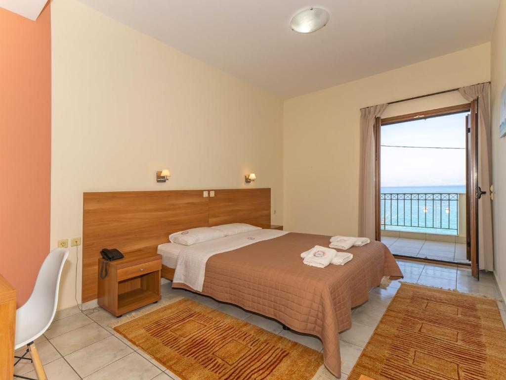 Postel nebo postele na pokoji v ubytování Sunset Hotel