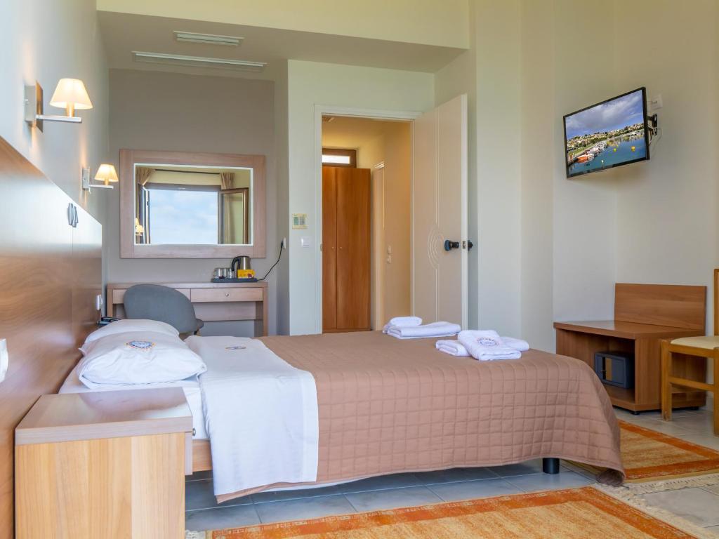 Postel nebo postele na pokoji v ubytování Sunset Hotel