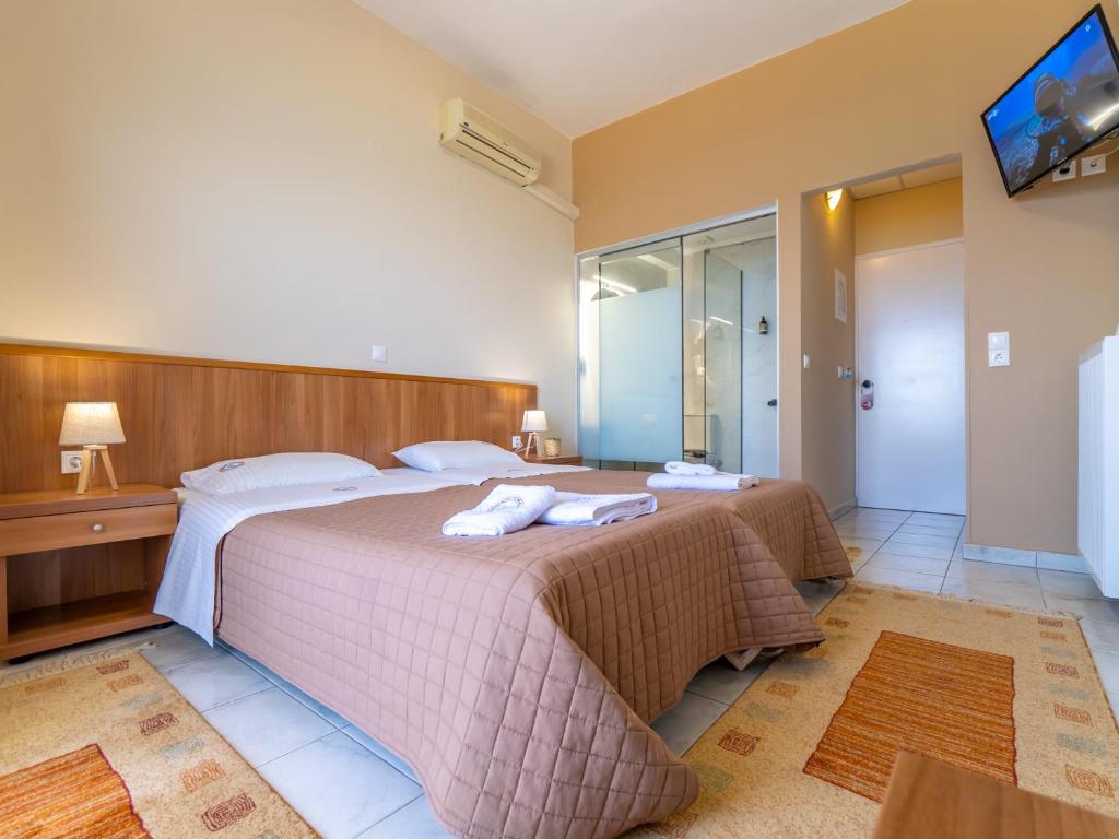 Postel nebo postele na pokoji v ubytování Sunset Hotel